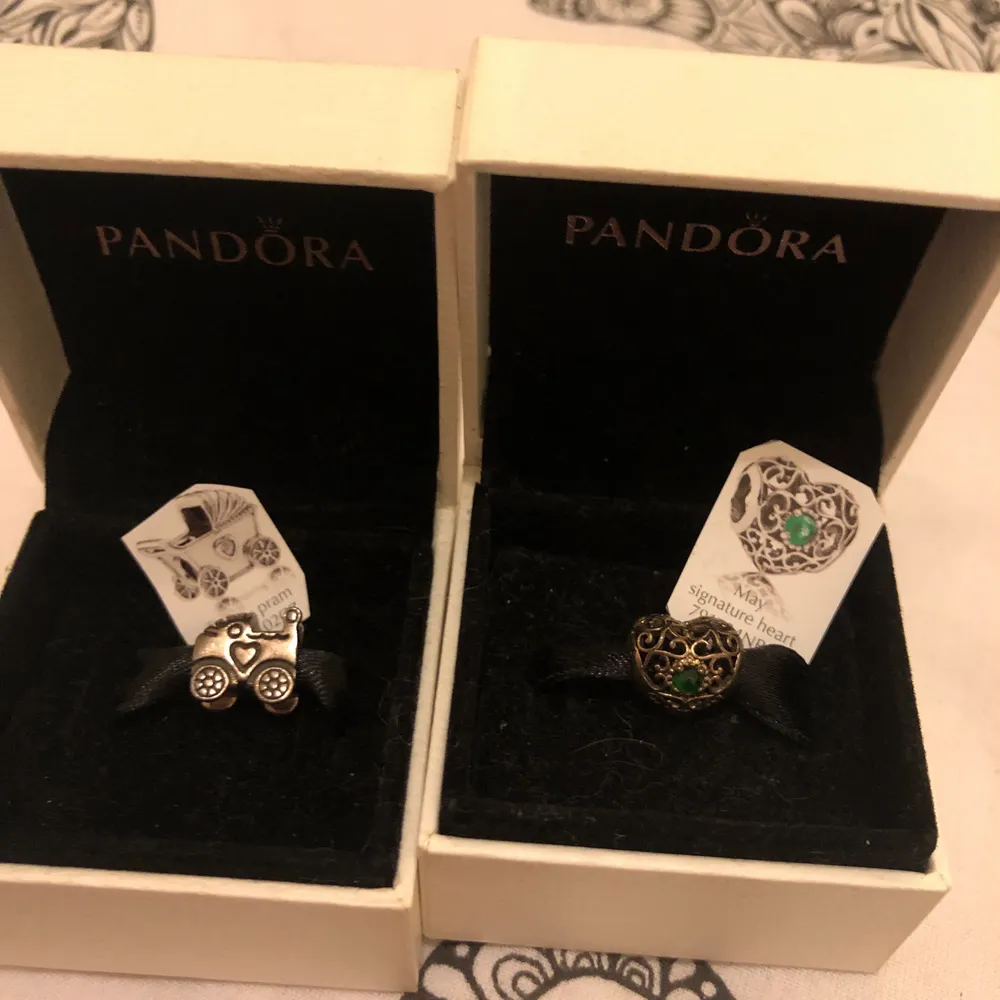 Pandora charms in excellent condition/new comes in original box and bag.. colour silver s925ale/green  prices are from £20 each . Accessoarer.