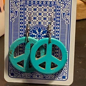 peace earrings  - turquoise, “hippie” peace earrings i bought in greece but never wore :( I love them tho they are so cute. They are about the size of a mer bottle cap. 