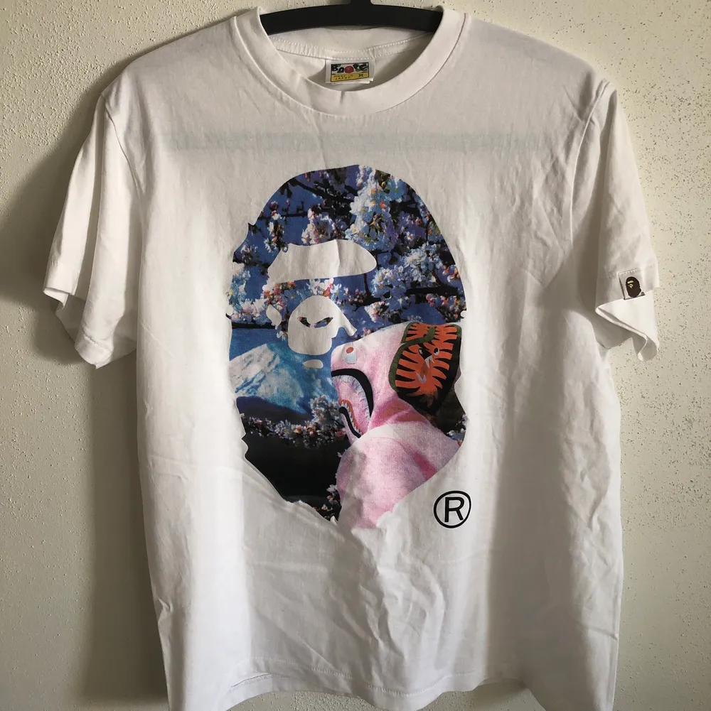 Bape / A Bathing Ape Sakura T-Shirt  Size medium, fits like a regular men’s small. Great condition, no flaws or damage.  DM if you need exact size measurements.   Buyer pays for all shipping costs. All items sent with tracking number.   No swaps, no trades, no offers. . T-shirts.