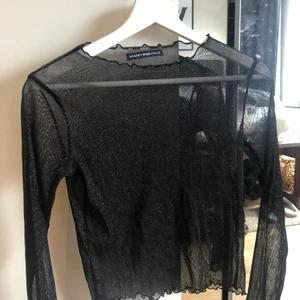 Brandy Melville topp - En svart och glittrig topp från Brandy Melville