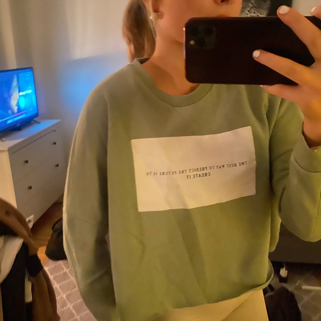 Grön sweatshirt med tryck på