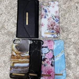 5 ideal of sweden skal+ plånbok iPhone 8 - Säljer 5st ideal of sweden skal+ plånbok då jag inte längre har en mobil som passar. Vissa av skalen är lite lite slitna men det märks knappt och plånboken är nästan som ny! Skalen passar iPhone 8. Hör av dig vid intresse/ fråga!💕 kan mötas men annars står köpare för frakt! ☺️