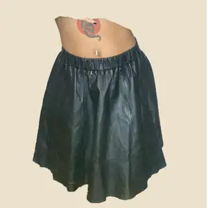 Selling this black leather skirt, with stretchy belt and cond. 9/10 
