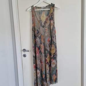 Super cute summer dress.  It is a transparent lovely dress only worn once. Perfect for a day at the beach!