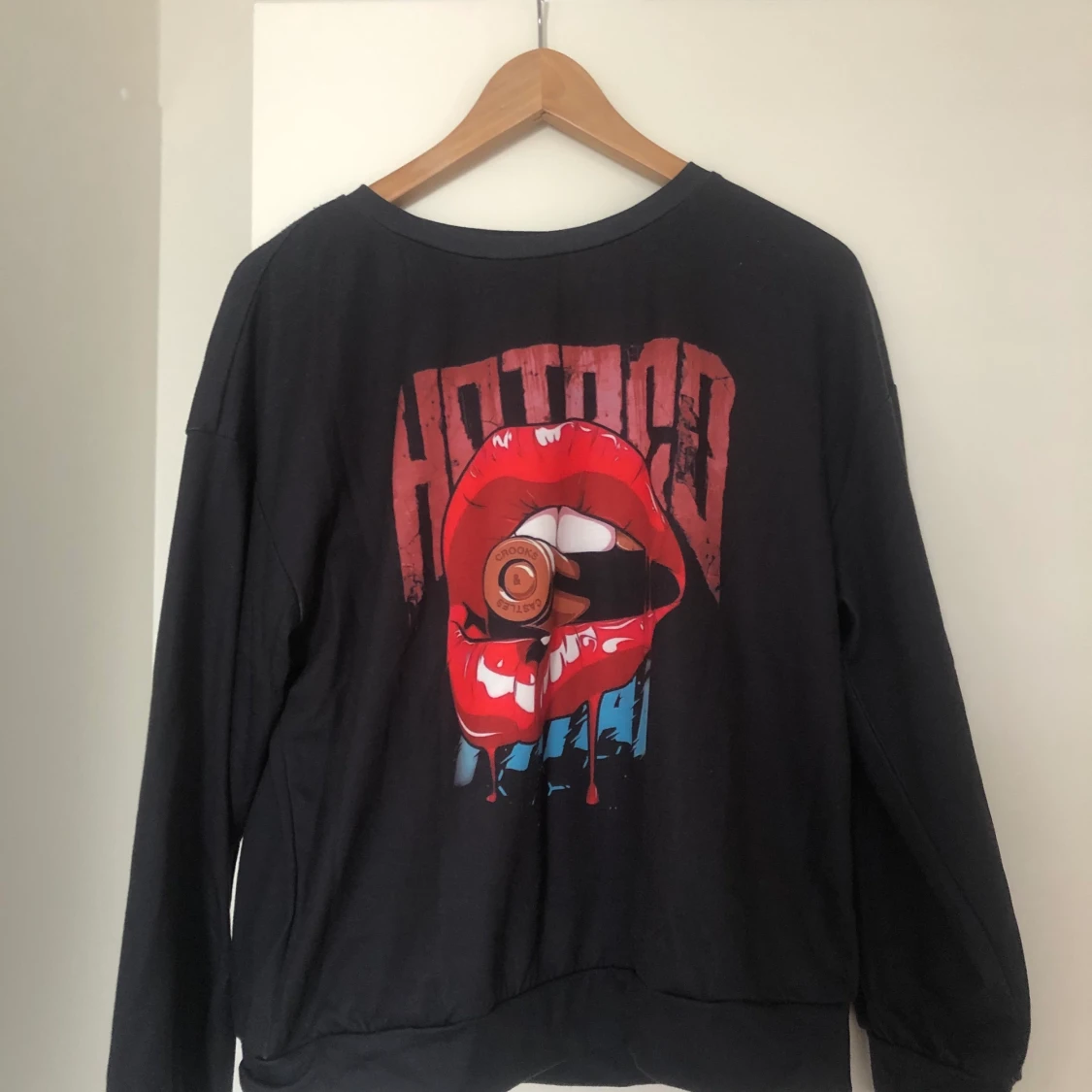 En sweatshirt i storlek M.