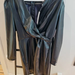 Skinnklänning - Liten i storlek, är som en 38