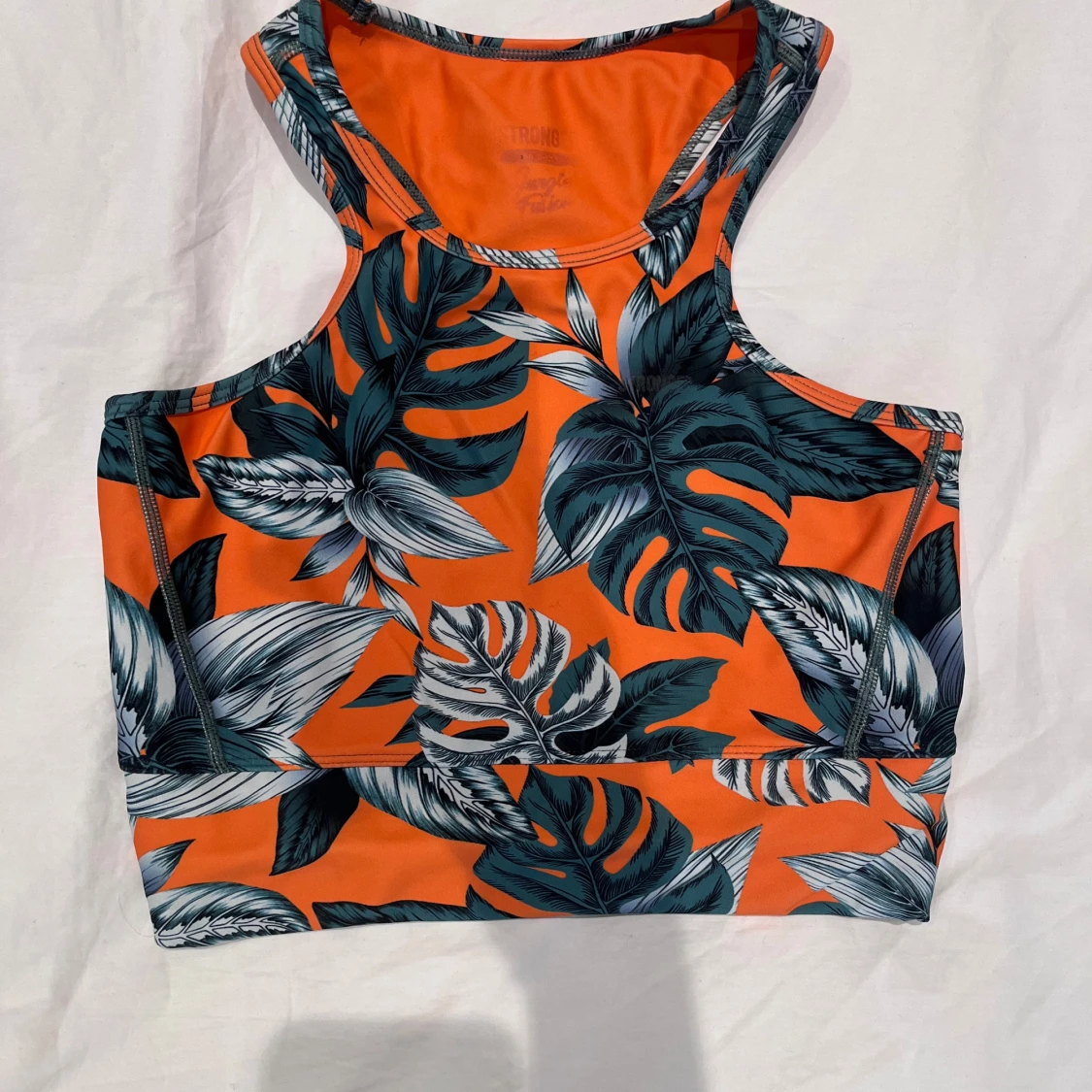 Orange mönstrat träningsset med gröna blad