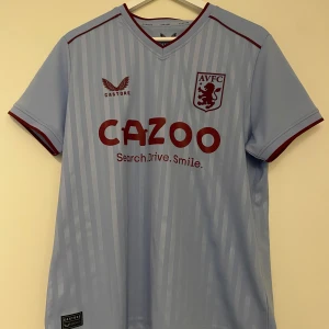 Aston Villa ljusblå fotbollströja - Snygg ljusblå Aston Villa fotbollströja. Aldrig använd. 