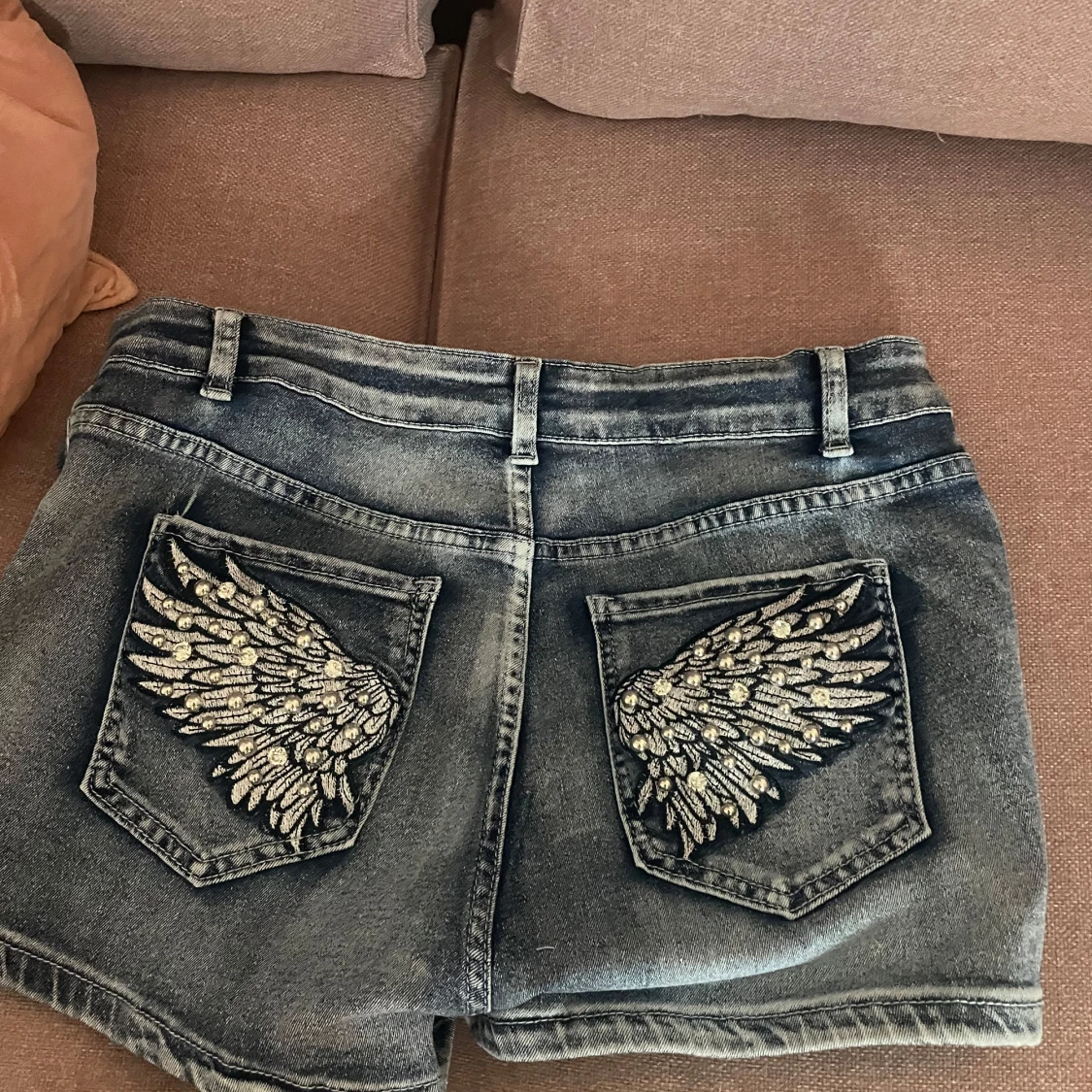 Blåa jeansshorts med vingar - 1