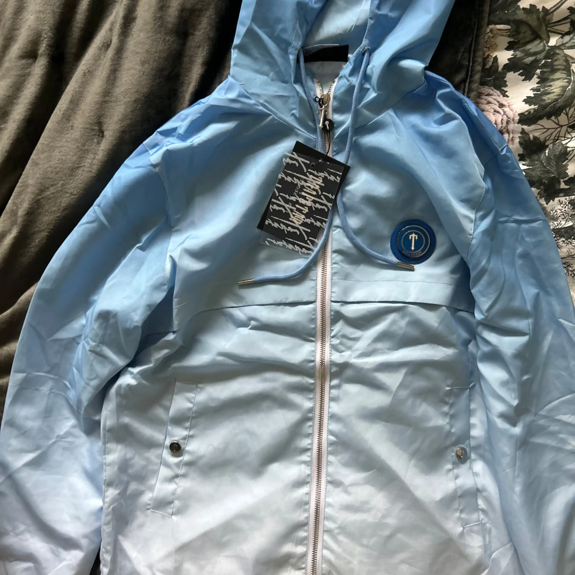 Ljusblå vindjacka från Transthe