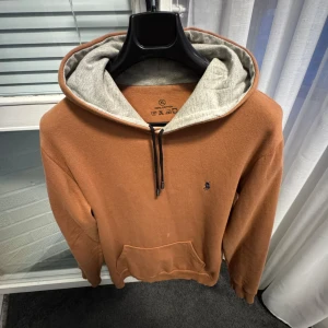 Brun hoodie från U.S. Polo Assn. - Storlek M. 