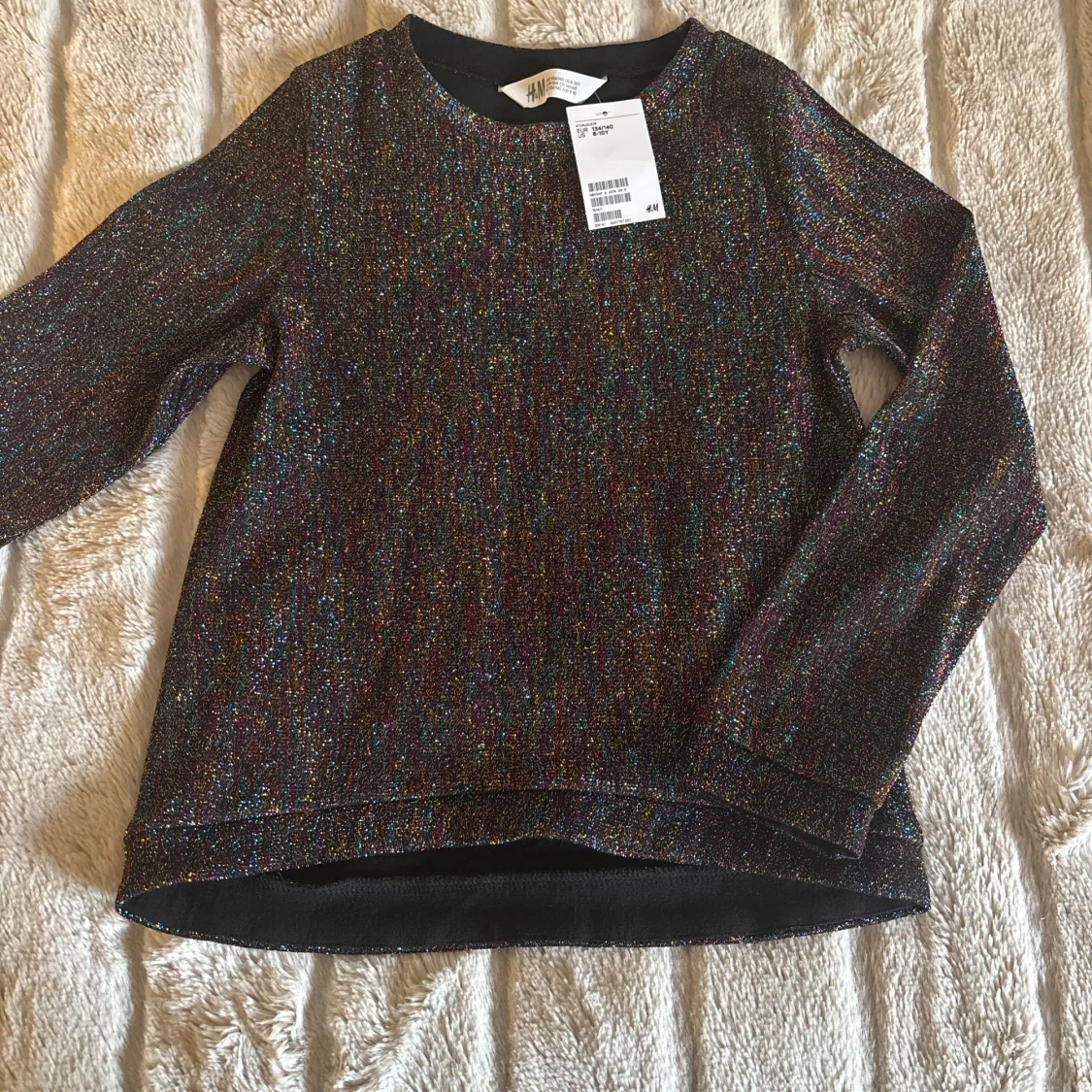 Glittrig långärmad tröja från H&M