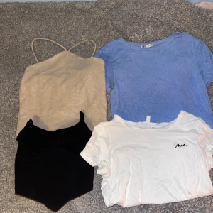 Olika tröjor  - Beige tröja från Lindex. Blå magtröja från hm. Svart linne från Hm. Vit T-shirt från hm.