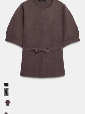 Brun zara tröja med knytband - Stilren brun tröja med korta ärmar och ett dekorativt knytband i midjan. Tröjan har rund halsringning och är tillverkad i ett mjukt, stickat material som ger en avslappnad men ändå chic. Endast använd 2 gånger. Helt slutsåld på Zara!!