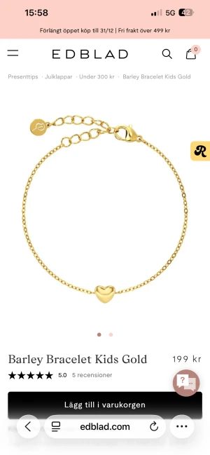 Guldarmband med hjärta från Edblad - Superfint guldarmband från Edblad med en tunn kedja och ett litet hjärta i mitten. Perfekt för dig som gillar stilrena och söta smycken. Justerbar längd med liten bricka vid låset. Säljer då det ej kommer till användning 