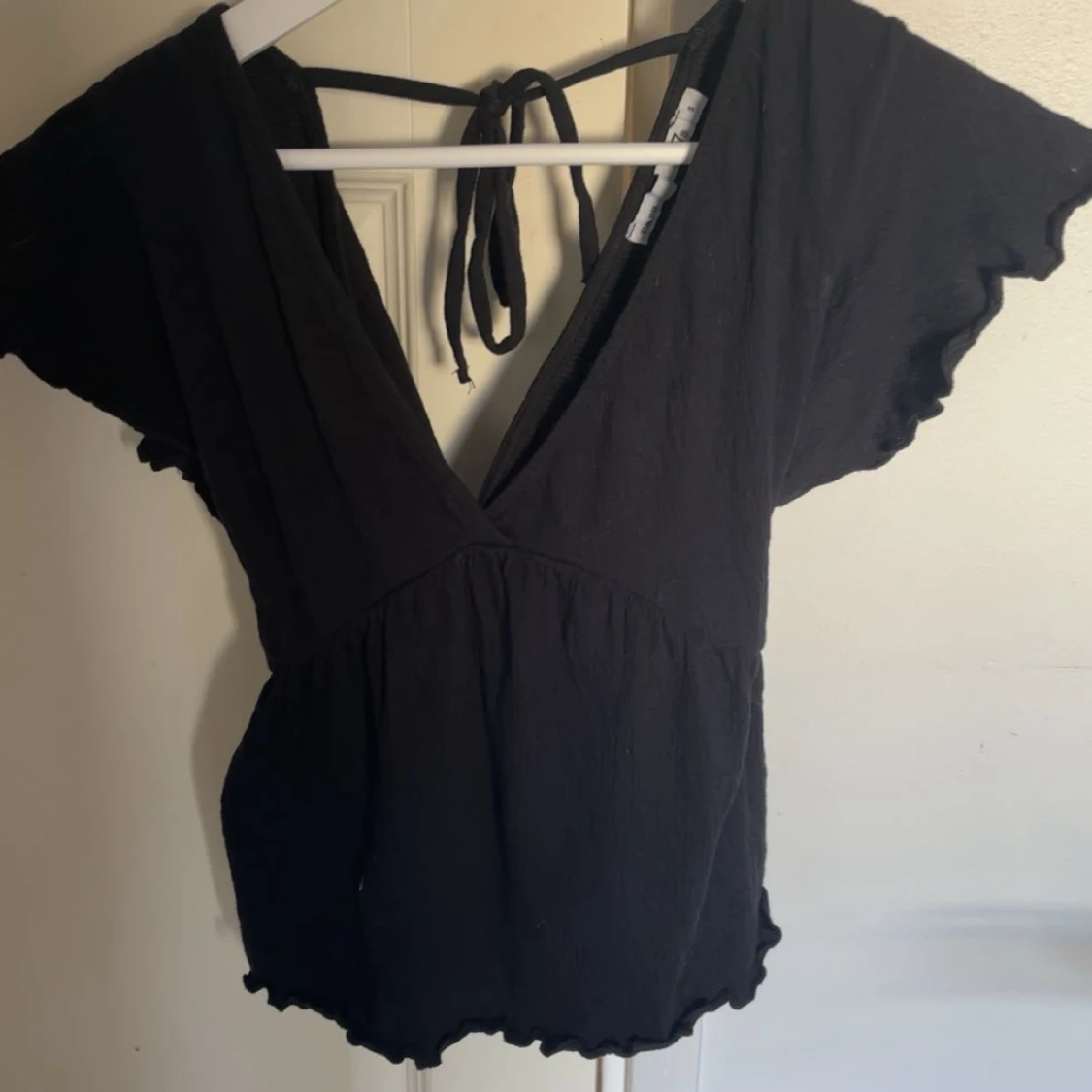Svart blus med v-ringning från 157 - 2