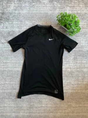 Nike compression shirt - Black Nike compression shirt 🖤, lightly used and in excellent condition. Designed for performance with a tight, supportive fit that’s perfect for training, gym sessions, or sports 💪. Breathable and comfortable material with the classic Nike logo ✨. Price is negotiable 💸.  Size: M Condition: Excellent / Lightly used ✅ 