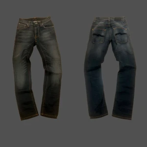 Nudie jeans slim fit 28/3” - Otroligt feta nudie jeans med skön fade i svart/mörkblå färg. Jeansen har inga defekter så vitt jag vitt. Skick (9,5/10). De är i storlek 28/30 med en slim passform. Bara att skriva vid fler frågor🥰 Mått [CM] x2: Längd ≈ 102 Midja ≈ 34 Vad ≈ 13,5 Lår ≈ 21,5 ‼️Mått kan variera med någon cm‼️ ⚠️Byxornas faktiska färg kan skilja sig från bilden.