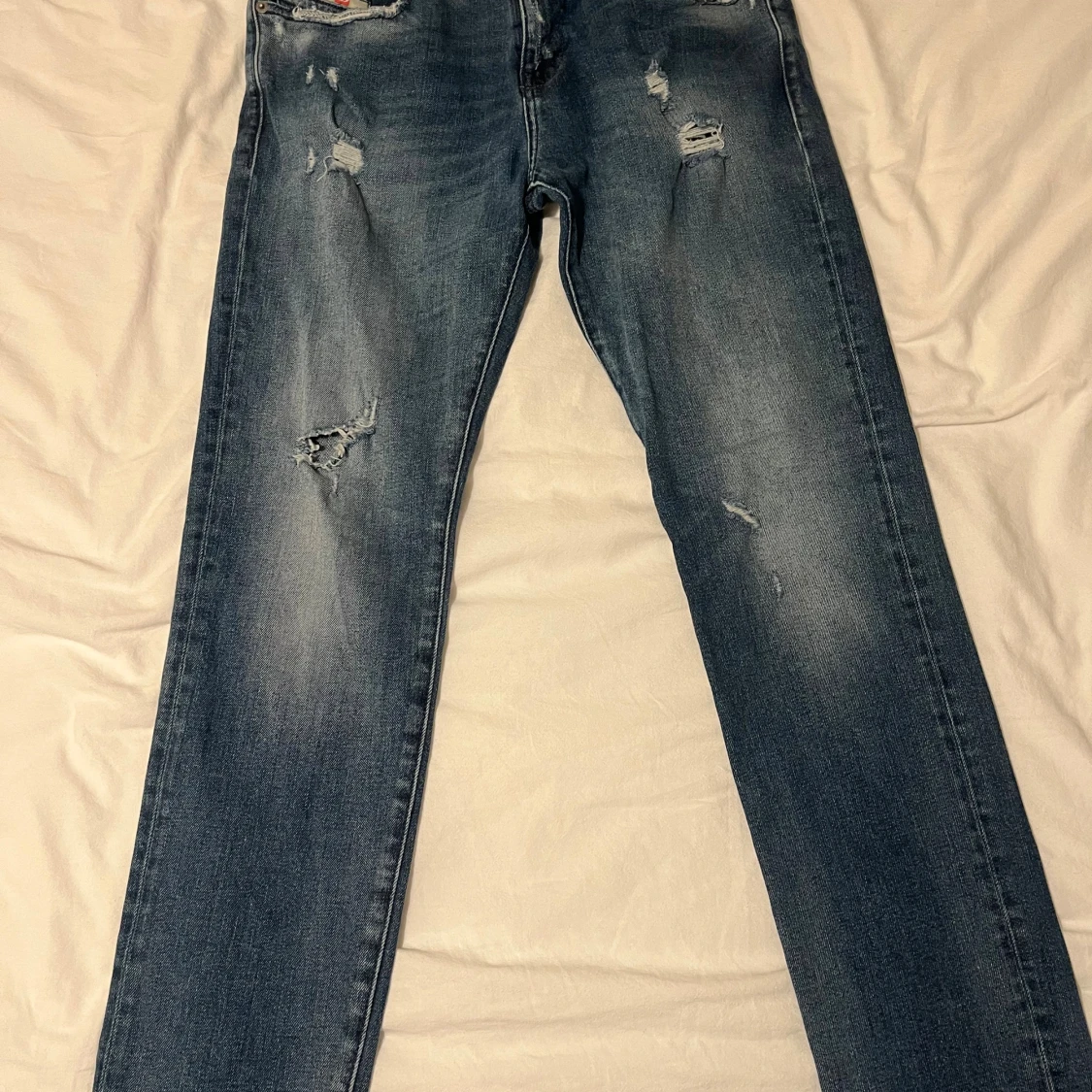 Blå slitna jeans från Diesel W31 L32