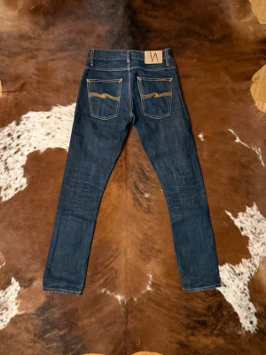 Selvage Nudie GrimTim - Tjena! Säljer dessa Selvage nudie jeans, modellen är GrimTim och sitter slim, W28/L32, hör av dig vid funderingar!🙌