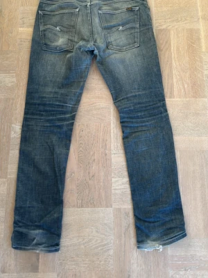 Blå jeans från Nudie Jeans - Säljer ett par blå jeans från Nudie Jeans i modellen grim Tim W34/L32