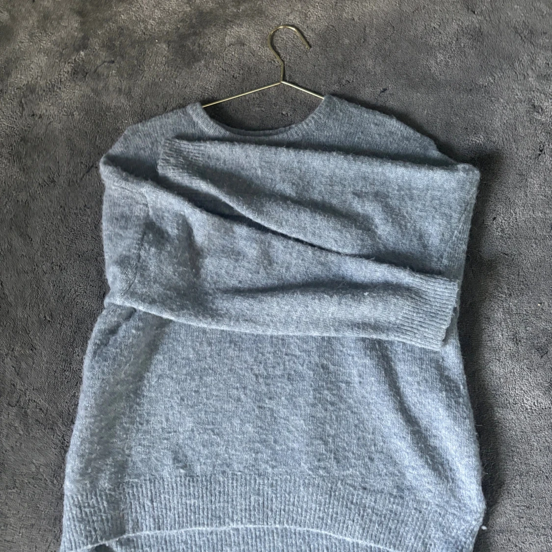 Ljusblå stickad tröja i alpackaull