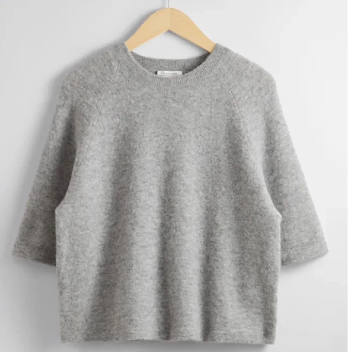 Trekvartsärmad stickad tröja 