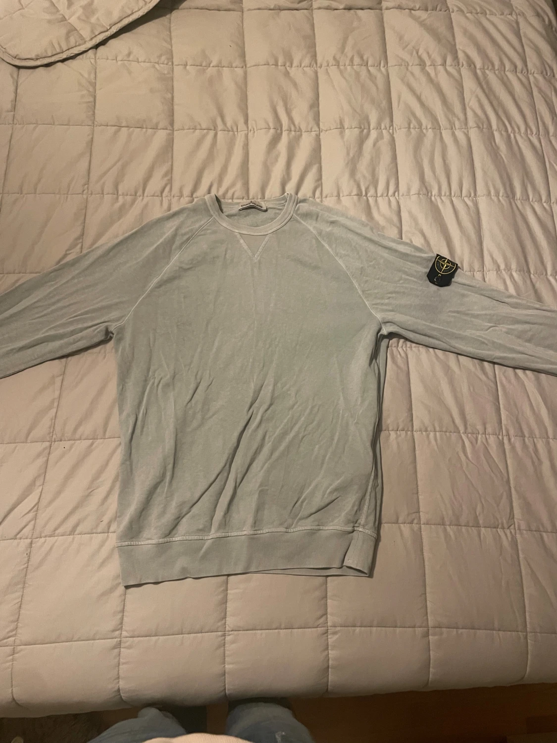 Ljusblå Stone Island sweatshirt
