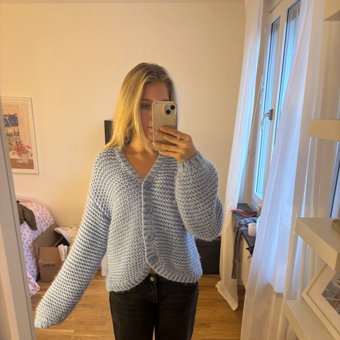 Ljusblå stickad kofta med knappar