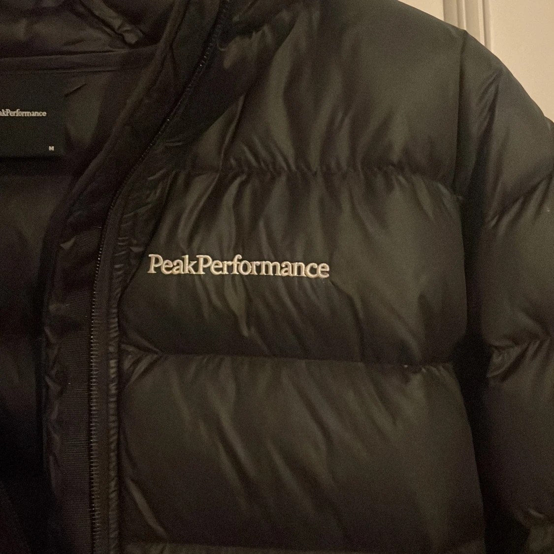 Svart dunjacka Peak Performance M - 1