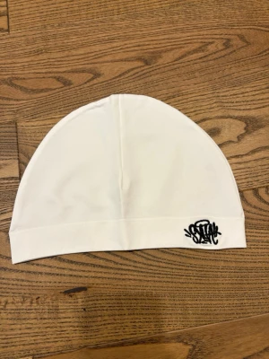 Syna world mössa  - Syna world mössa helt ny, snabb leverans 