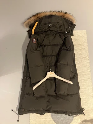Parajumpers Women's Long Bear Hooded Parka Olive Grey - Newer worn. Wrong buy by my mother. Parajumpers Women's Long Bear Hooded Parka Olive Grey with insulated coat fur. Perfect condition. Sizes is quite small. Will not sell for under asking price.