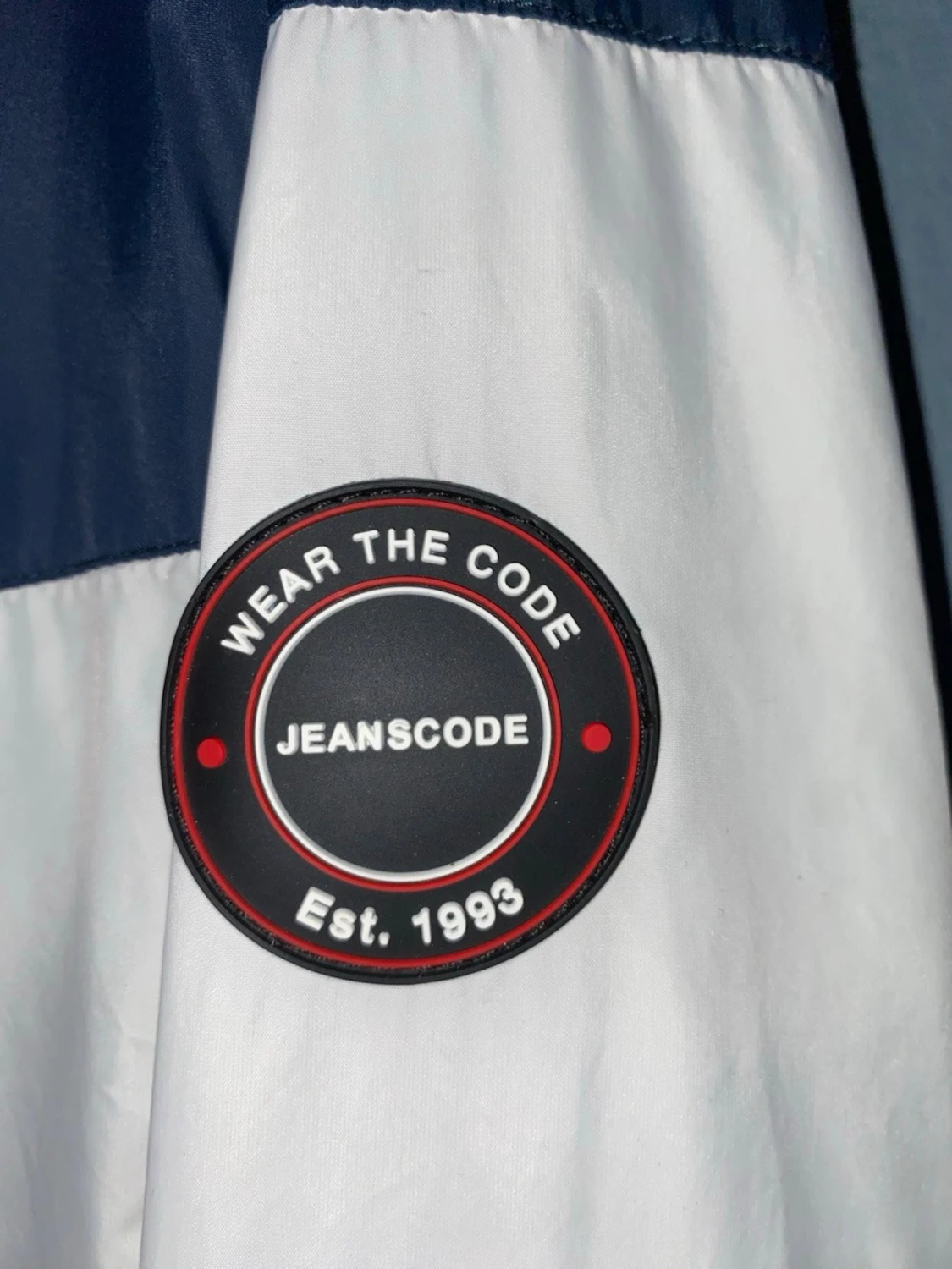 Vindjacka från Outernational i navy och beige - 2