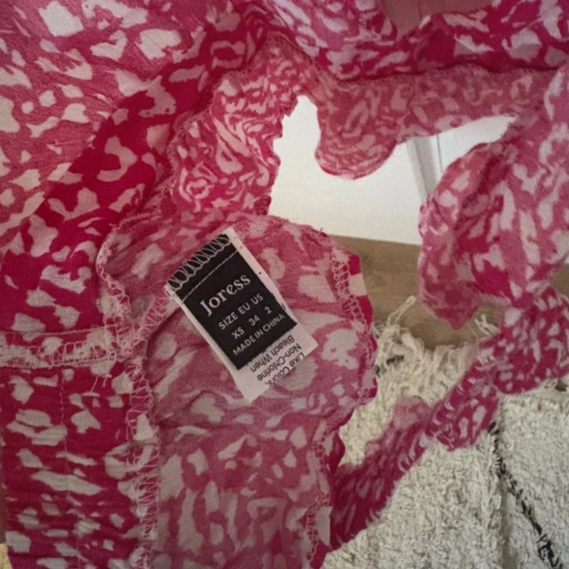 Rosa mönstrad linnetopp från Joress - 2