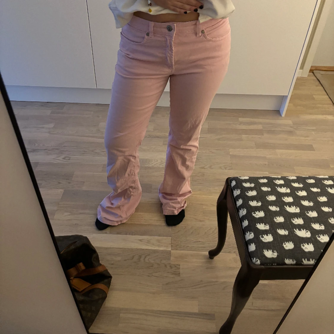 Rosa lågmidjade bootcutbyxor