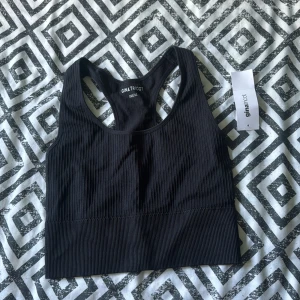 Seamless tanktop - Ny med prislapp säljer pga av fel storlek 