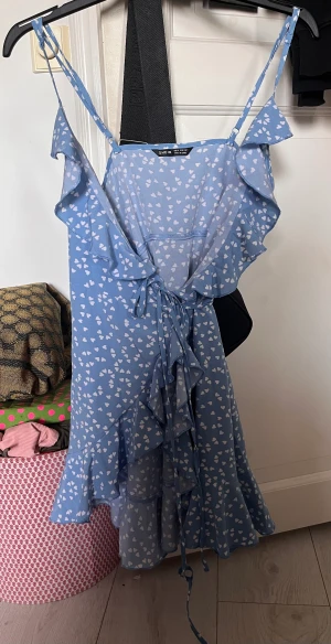 Light blue wrap dress - Cute wrap dress with heart pattern in great condition. Barely used. Size XS. Price can be discussed.