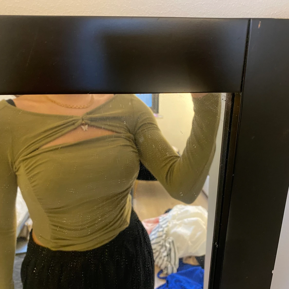 Grön topp med fjäril