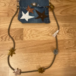 Self made denim brown and white clutch with straps - The crown and brown star is the button, self sewn with sewn on straps
