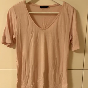Blekrosa tröja Stockholm LM - Stl. S Använd med i fint skick 