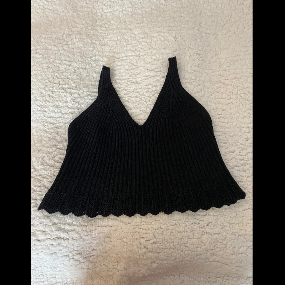 Stickad svart topp