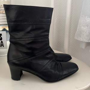 Black leather boots with square pointy front 