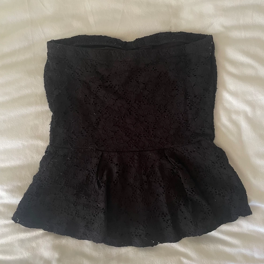 Svart peplum topp - 90