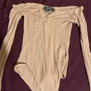 Rosa beige body - Säljs då den ej används. 