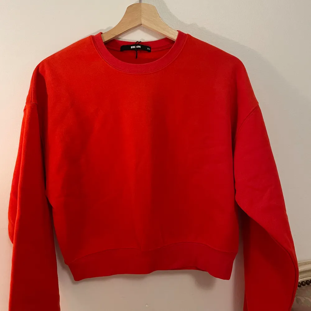 New red  sweatshirt . Hoodies.