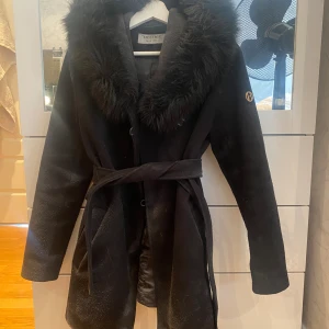 Hollies kappa - Nytt skick. Knappt använd.