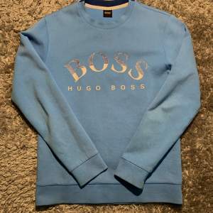 Unique Hugo Boss text (THIS IS NOT signs of use/damage to the shirt).Used with slight signs of wear. Price can be negotiated!