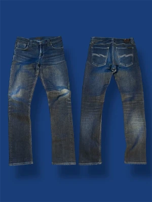 Nudie jeans Lean Dean 31/32 washed - Nu säljer vi ett par feta nudie jeans Lean Dean 31/32. Skicket är ofantligt bran tveka inte på att höra av dig vid minsta fundering! 🤩🤝Mått: längd| 101cm. Midja| 39cm. Benöppning| 16cm