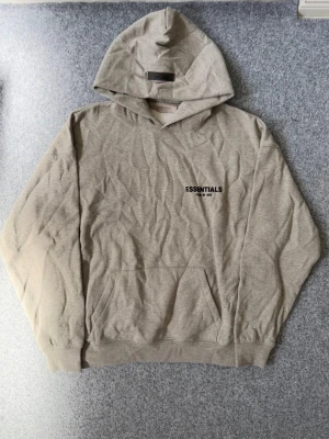 Essentials dark oatmeal gray hoodie - Size M, true to size. Just like new. Unused, please feel free to ask questions if needed. Only needs ironing