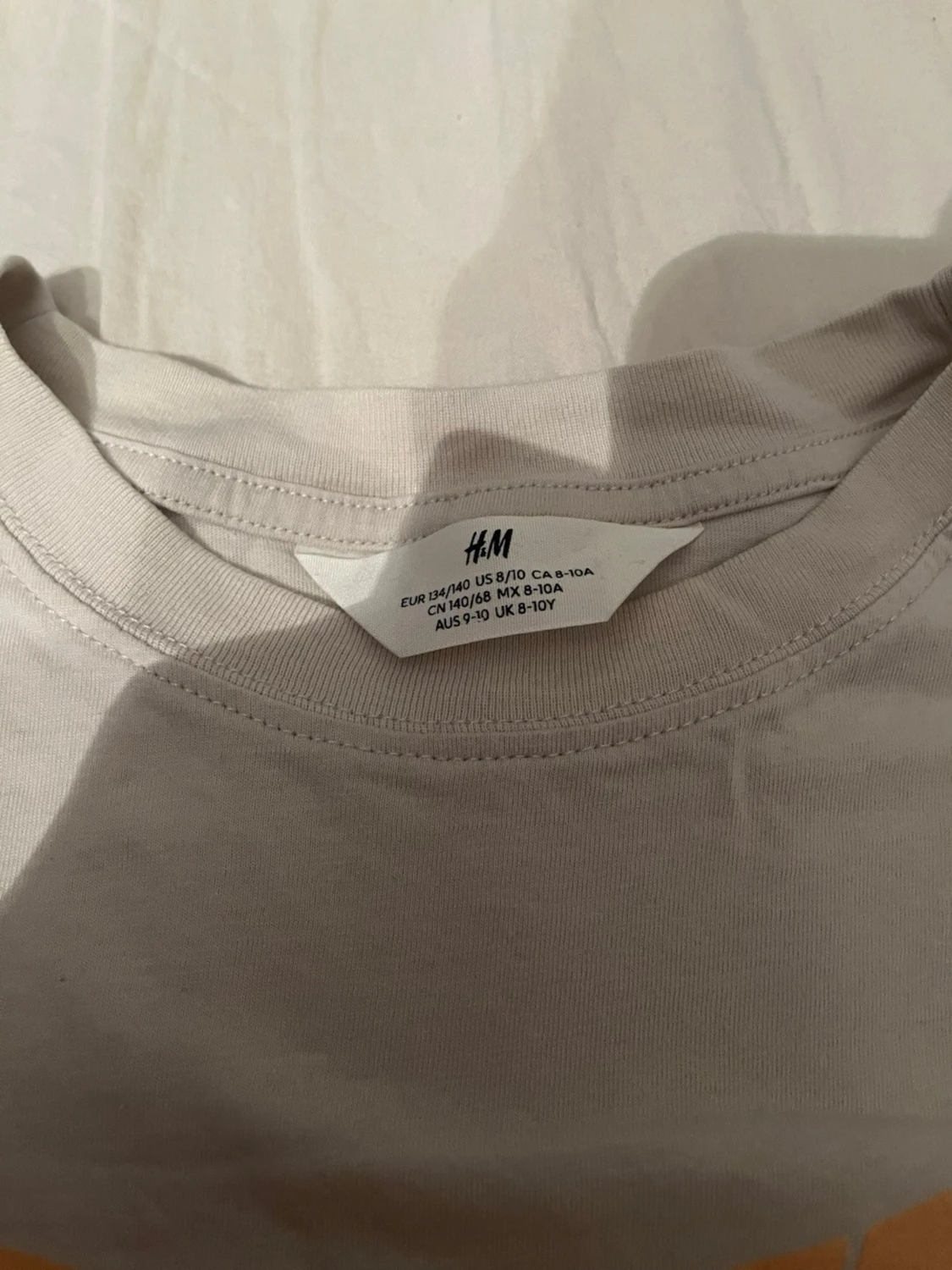 Vit ärmlös t-shirt från H&M - 1